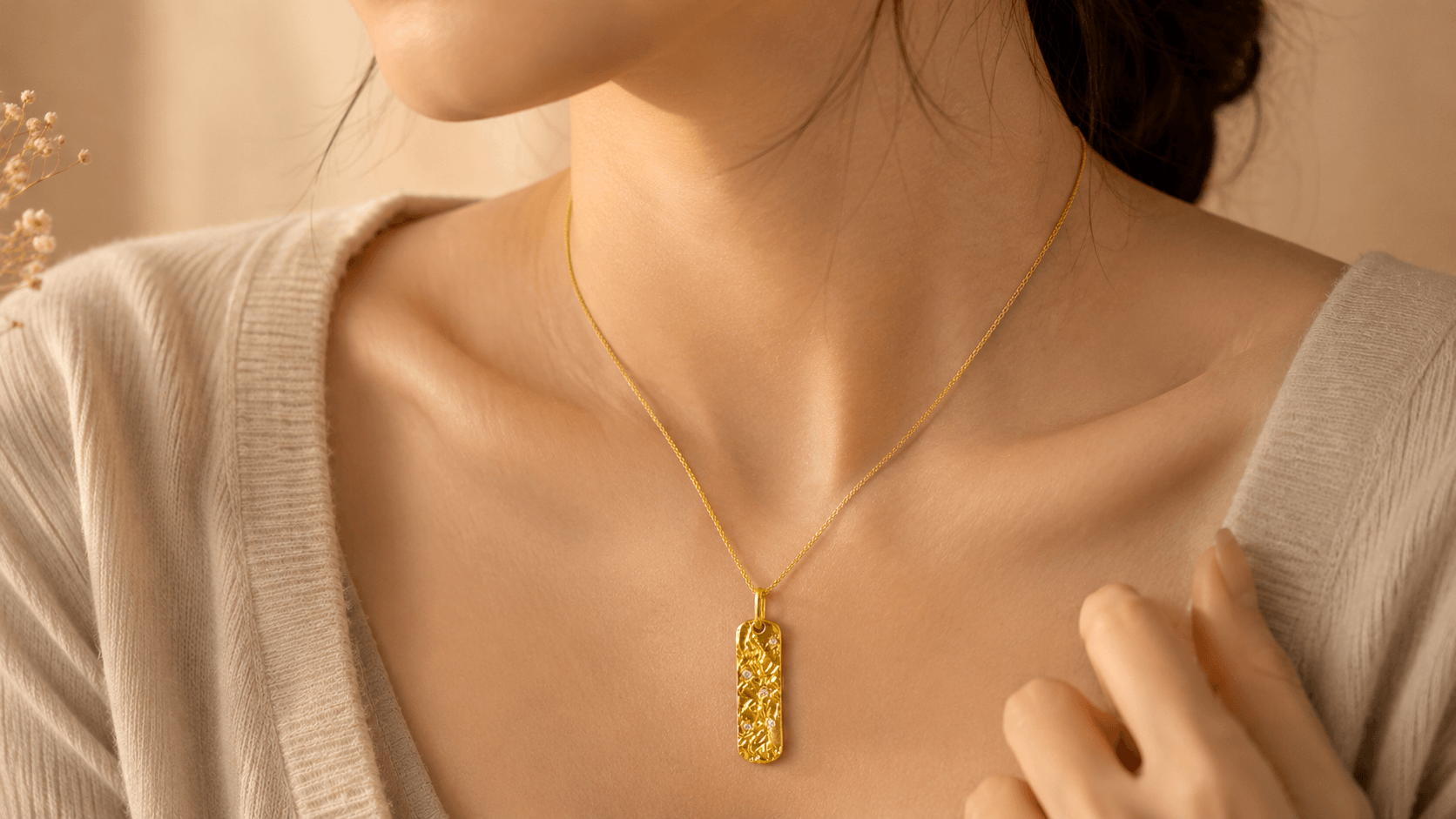 Woman wearing the Metal Element gold pendant necklace as an everyday necklace close to the heart
