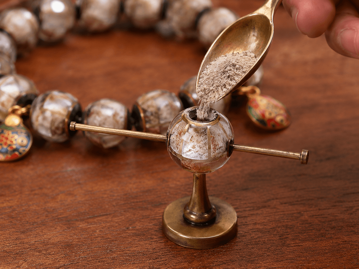 Taoist master holding a bracelet before the altar